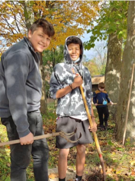 middle school students planting natives at Shawmut Hills sycamore circle mural site